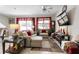 Spacious living room with sectional sofa and large windows at 9642 Sweetwell Pl, Riverview, FL 33569