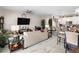 Open living space with beige sofa and dining area at 9642 Sweetwell Pl, Riverview, FL 33569