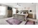 Spacious main bedroom with king-size bed and large dresser at 9642 Sweetwell Pl, Riverview, FL 33569