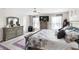 Main bedroom with king-size bed, dresser, and ensuite bathroom at 9642 Sweetwell Pl, Riverview, FL 33569