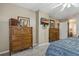 Bedroom with large dresser and views into bathroom at 3527 Yale Cir, Riverview, FL 33578