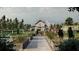 Community garden with barn, raised garden beds, and walking paths at 10169 Gentle Rain Dr, Land O Lakes, FL 34638