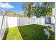 Artificial turf backyard with white vinyl fence at 108 E Chelsea St, Tampa, FL 33603