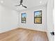 Spacious bedroom with hardwood floors and two large windows at 108 E Chelsea St, Tampa, FL 33603