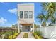 Contemporary gray house with a covered entryway and walkway at 108 E Chelsea St, Tampa, FL 33603