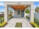 Covered entryway with wood ceiling and gray brick pavers at 108 E Chelsea St, Tampa, FL 33603