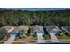 Aerial view of a neighborhood with houses, trees, and roads at 11036 Paradise Point Way, New Port Richey, FL 34654