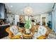 Kitchen breakfast nook with wicker chairs and a round glass table at 11036 Paradise Point Way, New Port Richey, FL 34654