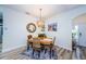 Dining area with wooden table, wicker chairs, and stylish decor at 11036 Paradise Point Way, New Port Richey, FL 34654