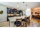 Kitchen island with seating for four and granite countertop at 11036 Paradise Point Way, New Port Richey, FL 34654