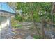 Large backyard with mature trees and grill at 11121 Roberts Ln, Riverview, FL 33578