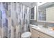 Clean bathroom with updated vanity and geometric shower curtain at 11121 Roberts Ln, Riverview, FL 33578