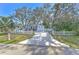 Cute bungalow with white picket fence and spacious driveway at 11121 Roberts Ln, Riverview, FL 33578