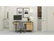 Functional home office with built-in desk and adjacent bathroom access at 11174 Wishing Cloud Rd, Land O Lakes, FL 34638