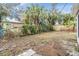 Large backyard with chain link fence and mature trees at 11882 104Th St, Largo, FL 33773