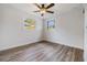 Bright bedroom with hardwood floors and ceiling fan at 11882 104Th St, Largo, FL 33773