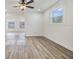 Spacious common area with hardwood floors and an arched doorway at 11882 104Th St, Largo, FL 33773