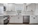 Newly renovated kitchen with white cabinets, stainless steel appliances, and white subway tile backsplash at 11882 104Th St, Largo, FL 33773