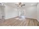 Living room with ceiling fan and access to other rooms at 11882 104Th St, Largo, FL 33773