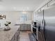 Modern kitchen with stainless steel appliances and island at 12772 Achasta Blvd, Hudson, FL 34669