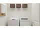 Laundry room with washer, dryer, and shelving at 13582 Newbridge St, Spring Hill, FL 34609