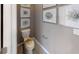 Simple powder room with a toilet and tasteful wall art at 14952 Serene Shores Loop, Lakewood Ranch, FL 34211