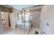 Large bathroom with a walk-in shower and a soaking tub at 14952 Serene Shores Loop, Lakewood Ranch, FL 34211