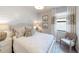 Charming bedroom with a queen-size bed and shiplap wall at 14952 Serene Shores Loop, Lakewood Ranch, FL 34211