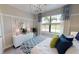 Guest bedroom with window seat and decorative pillows at 14952 Serene Shores Loop, Lakewood Ranch, FL 34211