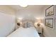 Guest bedroom with a queen bed, and shiplap accent wall at 14952 Serene Shores Loop, Lakewood Ranch, FL 34211