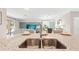 Kitchen island with a double sink overlooking the living room at 15053 Sea Salt Way, Bradenton, FL 34211