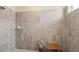 Large walk-in shower with gray tile and built-in bench at 15053 Sea Salt Way, Bradenton, FL 34211