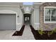 Front entry with gray pavers, double doors, and stone accents at 15143 Sea Salt Way, Bradenton, FL 34211