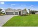 New construction home with gray siding and stone accents at 15143 Sea Salt Way, Bradenton, FL 34211