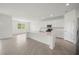 Modern kitchen with white cabinets and large island at 15143 Sea Salt Way, Bradenton, FL 34211