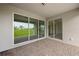 Covered patio with sliding glass doors and view of backyard at 15143 Sea Salt Way, Bradenton, FL 34211