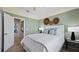 Guest bedroom with built-in drawers and access to a bathroom at 15218 Serene Shores Loop, Bradenton, FL 34211