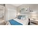 Bright bedroom with a queen bed and calming blue accents at 15218 Serene Shores Loop, Bradenton, FL 34211