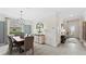 Elegant dining room features a wooden table, neutral decor, and entryway view at 15218 Serene Shores Loop, Bradenton, FL 34211