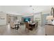 Bright dining room with a rustic wooden table and taupe chairs at 15218 Serene Shores Loop, Bradenton, FL 34211