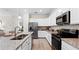 Modern kitchen with stainless steel appliances and granite countertops at 15218 Serene Shores Loop, Bradenton, FL 34211