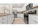 Bright kitchen featuring stainless steel appliances and granite countertops at 15218 Serene Shores Loop, Bradenton, FL 34211