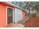 Backyard with deck, shed, and wood chips at 1530 Rollen Rd, Clearwater, FL 33755