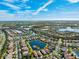 Aerial view of a community with houses and lakes at 15707 Crystal Waters Dr, Wimauma, FL 33598