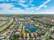 Aerial view of community with houses and lakes at 15707 Crystal Waters Dr, Wimauma, FL 33598