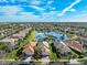 Aerial view of houses near a lake at 15707 Crystal Waters Dr, Wimauma, FL 33598