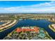 Community overview featuring a lake, clubhouse, and homes at 15707 Crystal Waters Dr, Wimauma, FL 33598