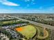 Aerial view showing community amenities including a baseball field at 15707 Crystal Waters Dr, Wimauma, FL 33598