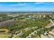 Aerial view of community featuring a lake, park, and homes at 15707 Crystal Waters Dr, Wimauma, FL 33598