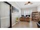 Home office with built-in shelving and hardwood desk at 15707 Crystal Waters Dr, Wimauma, FL 33598